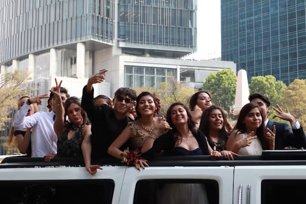 Happy customers enjoying luxury limousine service from transportwayhub.pro during a memorable event.